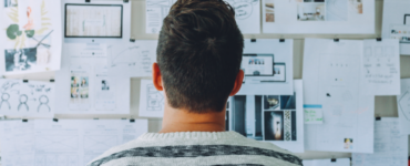 person looking at complicated white board coso framework